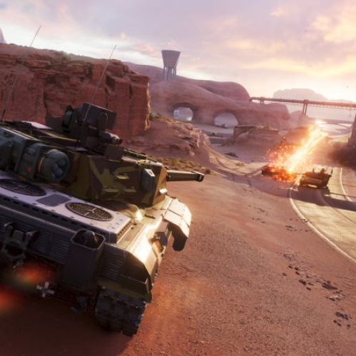 Escena de combate con tanques avanzando por un cañón desértico mientras uno de ellos recibe un impacto explosivo.