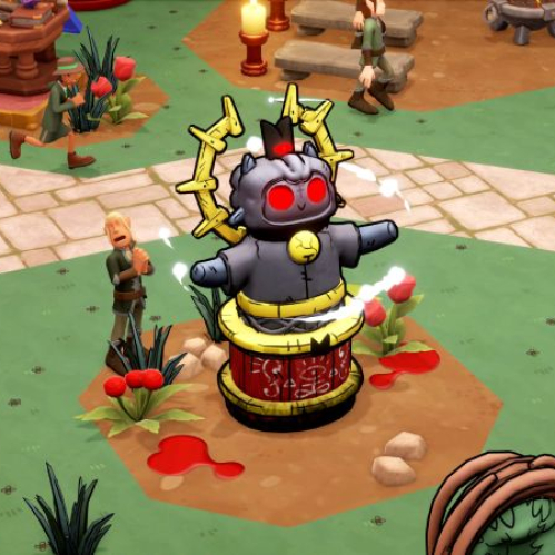Captura de pantalla del videojuego Two Point Museum durante la colaboración con Cult of the Lamb. En el centro de la escena, sobre un parche de tierra con manchas de sangre en un patio ajardinado, se erige un santuario y altar temático con una estatua de madera y piedra del Cordero con ojos rojos brillantes y una corona dorada. A la izquierda, un visitante del museo con ropas verdes se encuentra de rodillas venerando el altar. Al fondo se observan senderos de piedra, bancos, flores y mesas de exhibición del museo.