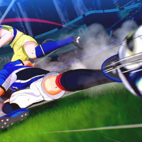 Captura de pantalla de "CAPTAIN TSUBASA 2: WORLD FIGHTERS" donde se aprecia a Tsubasa Ozora vistiendo la camiseta azul de Japón realizando un potente disparo en barrida sobre el césped, disputando el balón frente a un rival con uniforme amarillo bajo luces de estadio.
