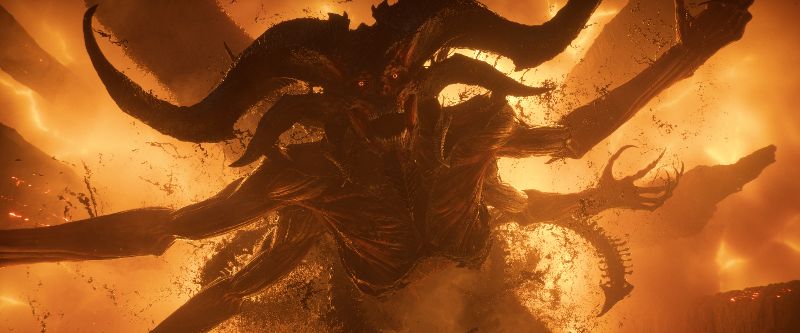 Criatura demoníaca rodeada de llamas intensas en un entorno infernal.