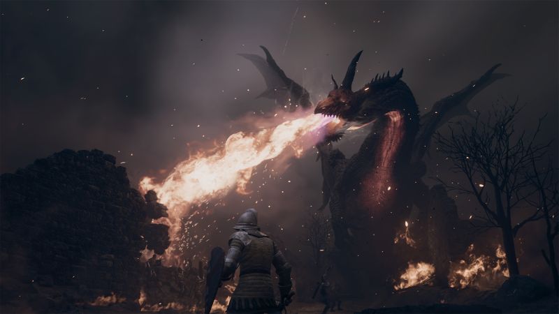 Un caballero con escudo y espada enfrenta a un dragón que lanza fuego en un entorno oscuro y lleno de llamas.