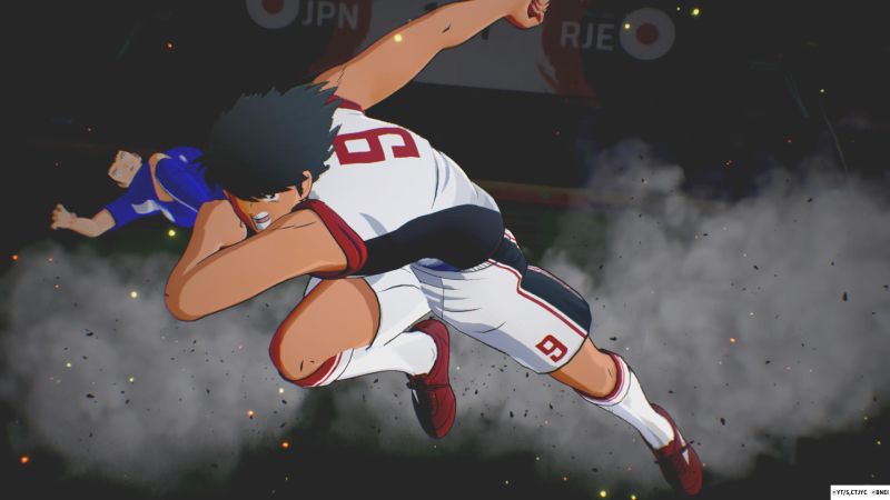 Barrida potente y embestida de Kojiro Hyuga Kojiro Hyuga realizando una embestida defensiva de gran potencia levantando una nube de polvo mientras derriba a un oponente.